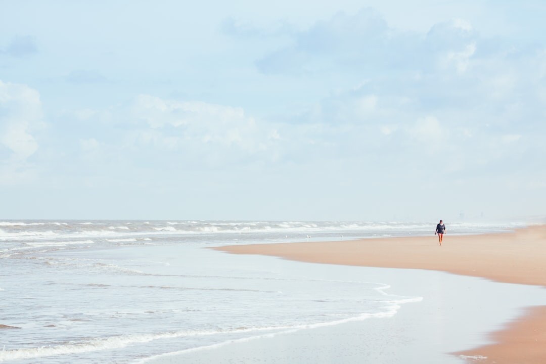 surfer on empty beach