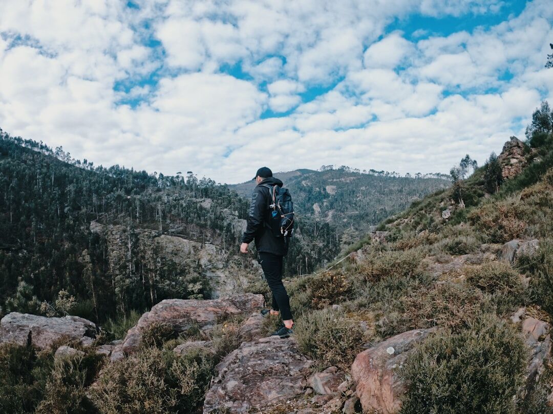singer hiking in mountains